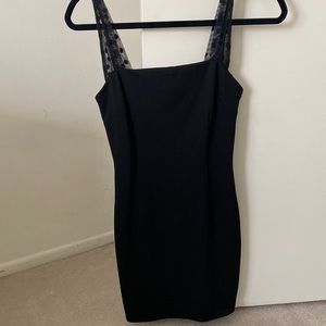 Super down black mini dress with mesh polka dot straps